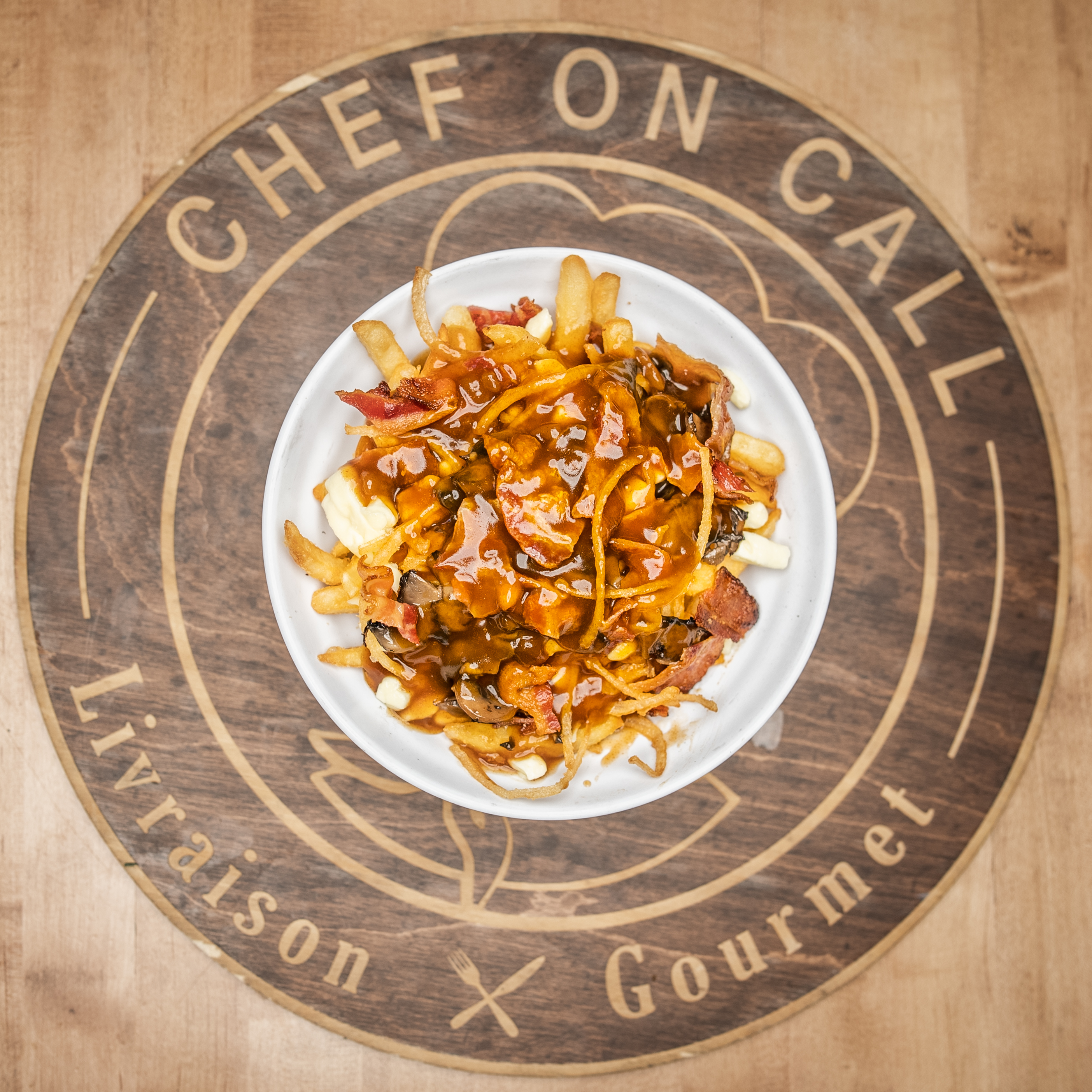 Canadian Poutine - Golden fries, Quebec cheese curds, crispy fried on...